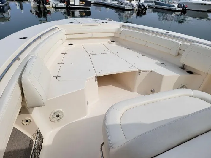 Yacht Photos Pics 2017 Grady-White 376 Canyon boat interior with cushioned seating and storage compartments.