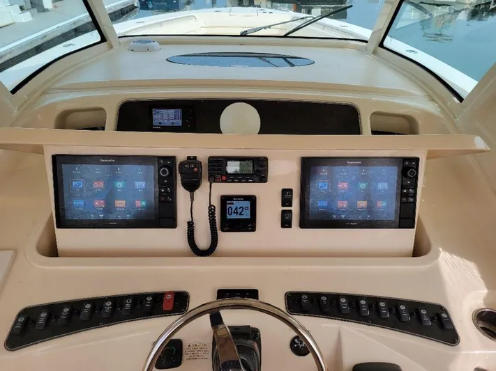  Yacht Photos Pics 2017 Grady-White 376 Canyon helm with dual touchscreens and navigation controls.