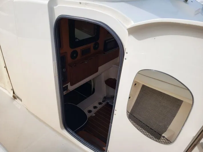 Yacht Photos Pics 2017 Grady-White 376 Canyon cabin entrance with wooden interior.