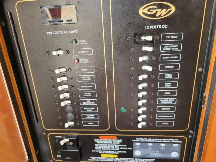  Yacht Photos Pics Control panel of a 2017 Grady-White 376 Canyon boat showing 120V AC and 12V DC switches.