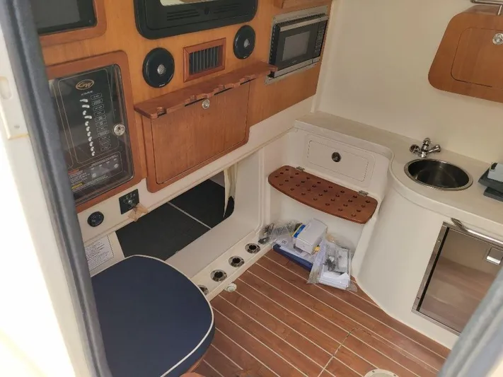  Yacht Photos Pics 2017 Grady-White 376 Canyon cabin interior with wooden accents and modern amenities.