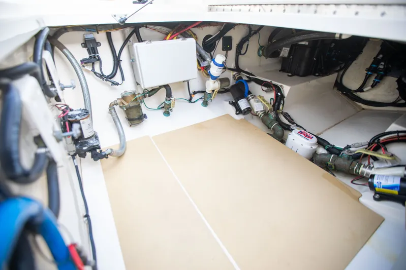  Yacht Photos Pics Engine compartment of a 2019 Scout 355 LXF boat, showcasing wiring and mechanical components.