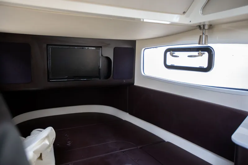  Yacht Photos Pics Interior cabin of 2019 Scout 355 LXF boat with TV and window.