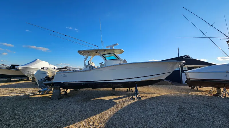  Yacht Photos Pics 2019 Scout 355 LXF boat on dry dock under sunny skies.