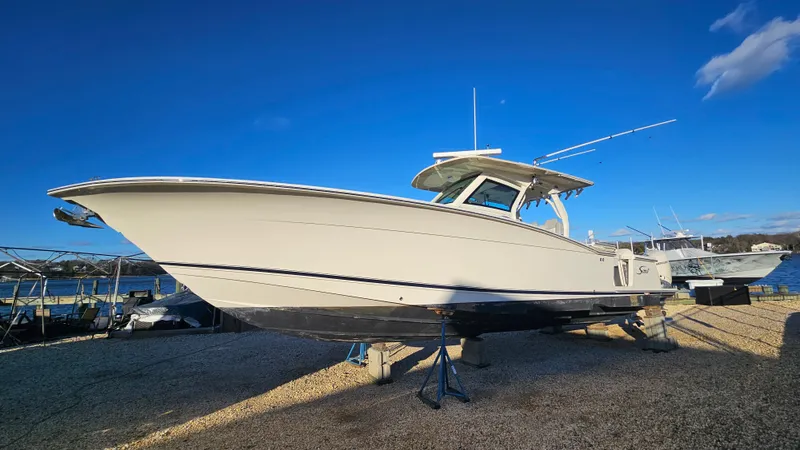  Yacht Photos Pics 2019 Scout 355 LXF boat on stands by the shore.