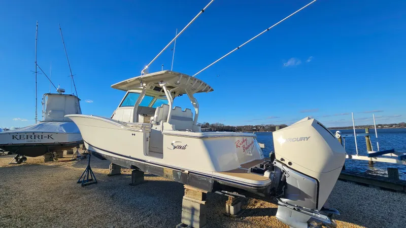  Yacht Photos Pics Scout 355 LXF 2019 boat by the water with blue sky.