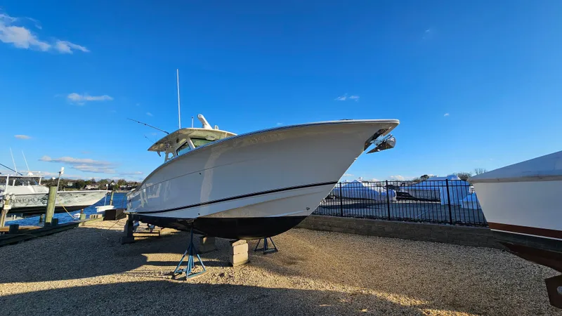  Yacht Photos Pics Scout 355 LXF 2019 on a boatyard under sunny skies.