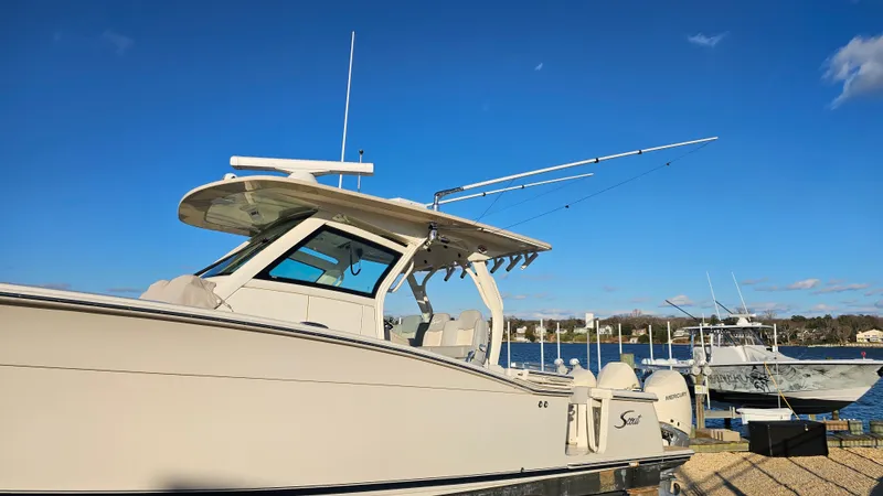  Yacht Photos Pics 2019 Scout 355 LXF boat docked under clear blue sky.