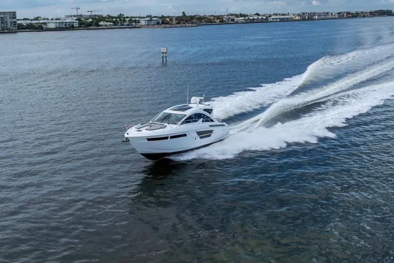 Tropical Dreamer Yacht Photos Pics 2022 Cruisers Yachts 54 Cantius speeding on open water.