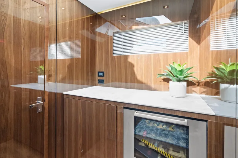 Tropical Dreamer Yacht Photos Pics Luxurious 2022 Cruisers Yachts 54 Cantius interior with wood paneling and modern decor.