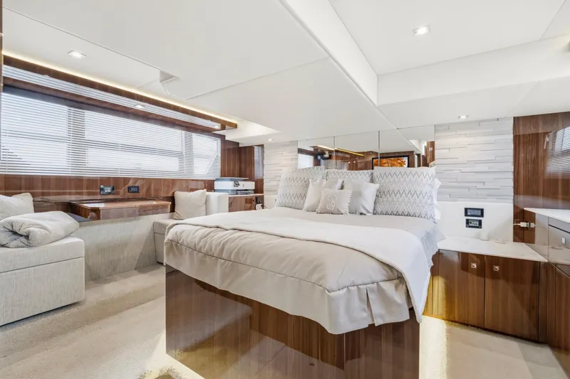 Tropical Dreamer Yacht Photos Pics Luxurious bedroom interior of 2022 Cruisers Yachts 54 Cantius with modern design and elegant furnishings.