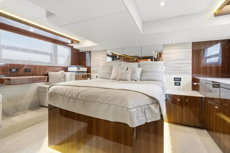 Tropical Dreamer Yacht Photos Pics Luxurious bedroom interior of 2022 Cruisers Yachts 54 Cantius with elegant wood finishes.