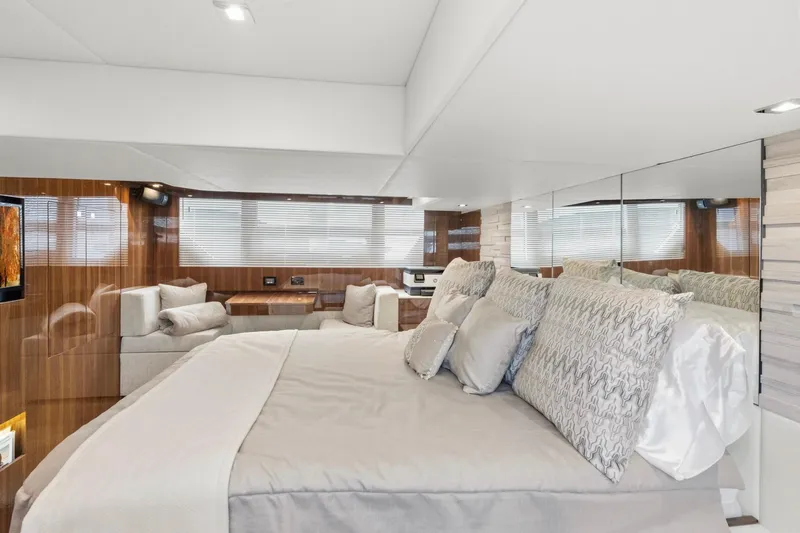 Tropical Dreamer Yacht Photos Pics Luxurious bedroom interior of 2022 Cruisers Yachts 54 Cantius with elegant decor and plush bedding.