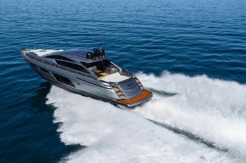  Yacht Photos Pics 2025 Pershing 6X yacht cruising on open water, showcasing sleek design and powerful performance.