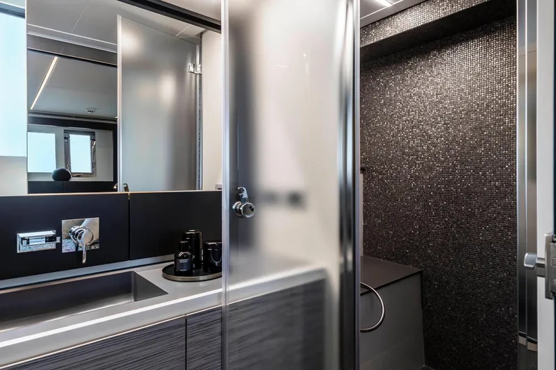  Yacht Photos Pics Luxurious bathroom interior of 2025 Pershing 6X yacht with modern fixtures and sleek design.