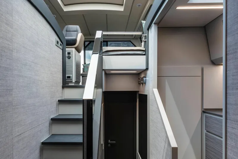  Yacht Photos Pics Interior of 2025 Pershing 6X yacht, featuring modern stairs and sleek design elements.