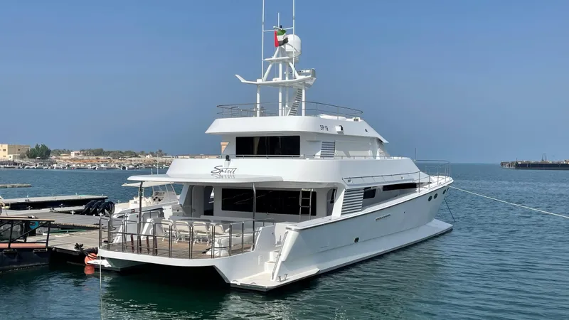 Spirit Yacht Photos Pics Luxurious 1999 Custom Austral Yachts Wavepiercer docked in serene marina setting.