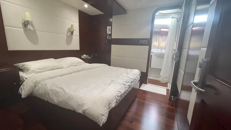 Spirit Yacht Photos Pics Luxurious cabin interior of 1999 Austral Yachts Wavepiercer with elegant wood flooring.