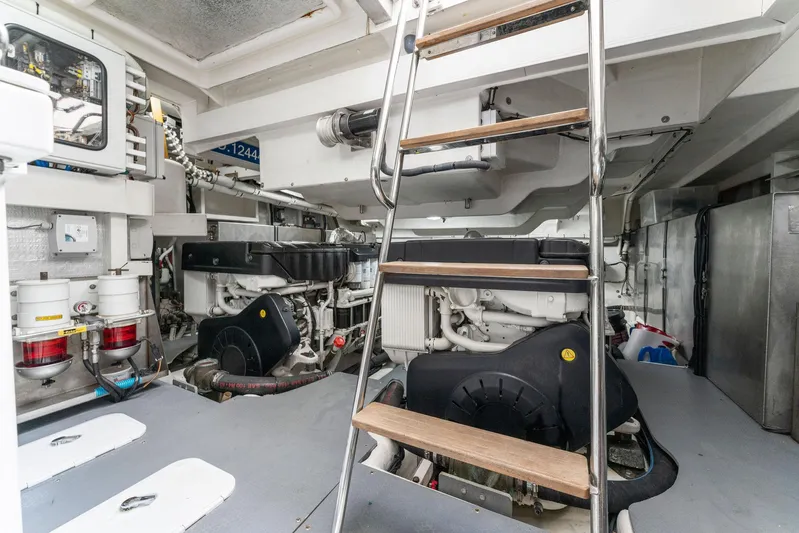 Blue Daksa Yacht Photos Pics Engine room of a 2013 Absolute 64 yacht, featuring machinery and a ladder.