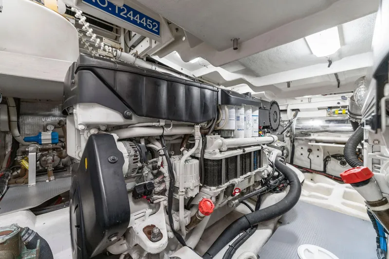Blue Daksa Yacht Photos Pics Engine room of a 2013 Absolute 64 yacht, showcasing detailed machinery and components.