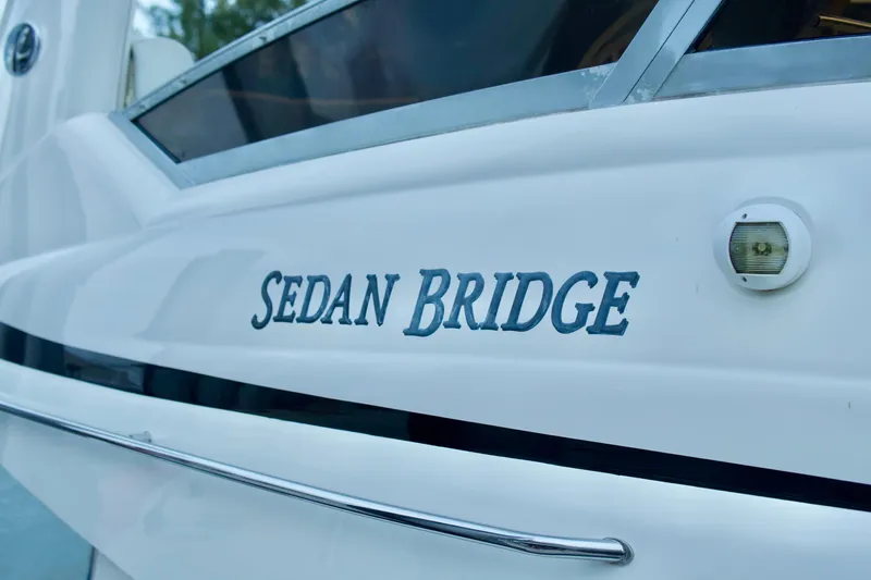  Yacht Photos Pics 2006 Sea Ray 44 Sedan Bridge yacht, close-up of model name on hull.