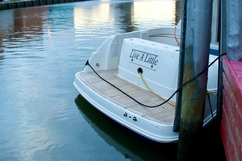  Yacht Photos Pics 2006 Sea Ray 44 Sedan Bridge docked, displaying "Live A Little" on the stern.