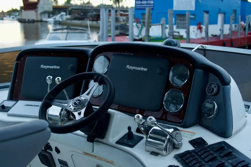  Yacht Photos Pics 2006 Sea Ray 44 Sedan Bridge helm with Raymarine navigation system.