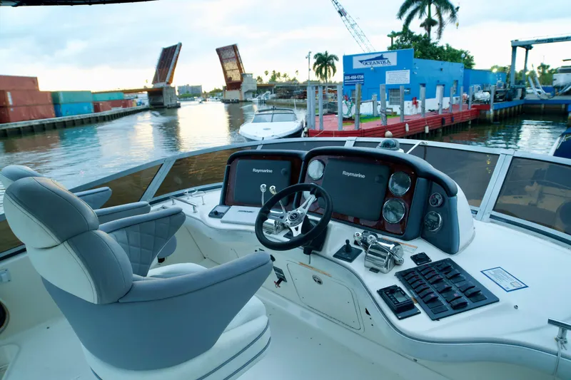  Yacht Photos Pics 2006 Sea Ray 44 Sedan Bridge helm with dual Raymarine displays, dockside view.