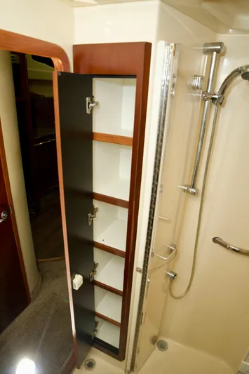 Yacht Photos Pics 2006 Sea Ray 44 Sedan Bridge bathroom with shower and open storage cabinet.