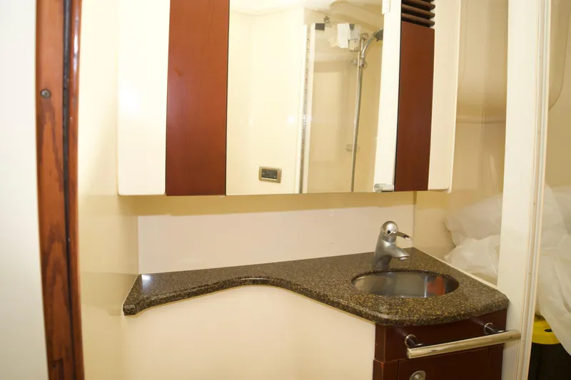  Yacht Photos Pics 2006 Sea Ray 44 Sedan Bridge bathroom with modern sink and mirror.