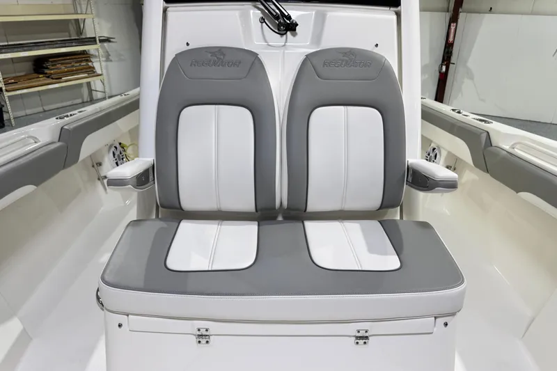  Yacht Photos Pics 2023 Regulator 28 boat interior with dual gray and white cushioned seats.