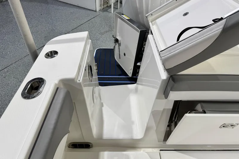  Yacht Photos Pics 2023 Regulator 28 boat interior with storage compartments and seating.