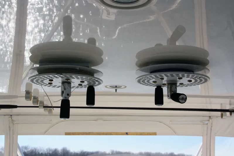 Lineage Yacht Photos Pics Ceiling-mounted fishing rod holders on a 2003 Bertram 390 Convertible boat.