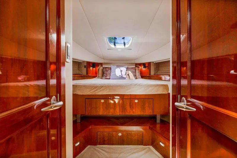  Yacht Photos Pics Luxurious cabin interior of 2007 Sea Ray 48 Sundancer yacht with wood finish.