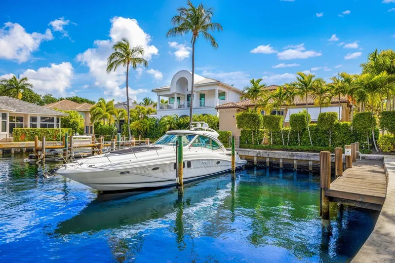  Yacht Photos Pics 2007 Sea Ray 48 Sundancer yacht docked in a sunny, tropical marina setting.