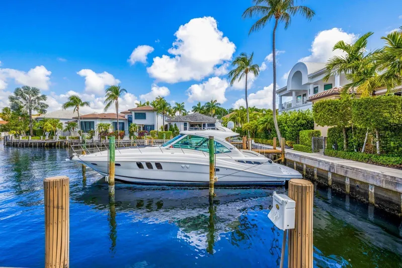 Yacht Photos Pics 2007 Sea Ray 48 Sundancer yacht docked in a scenic waterfront neighborhood.