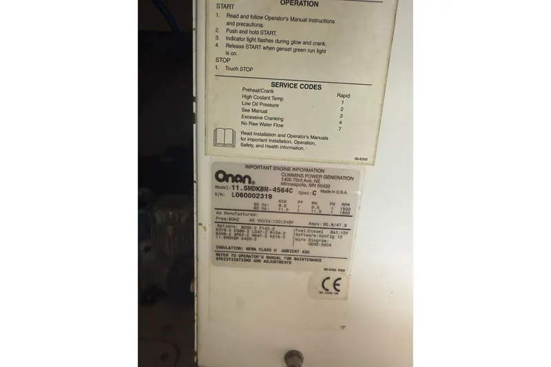  Yacht Photos Pics Onan generator label on 2007 Sea Ray 48 Sundancer, showing operation and service codes.
