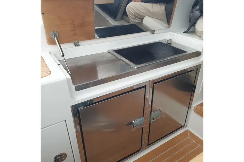 Point Break Yacht Photos Pics 2021 Bluegame BG 42 yacht kitchen area with stainless steel cabinets and grill.