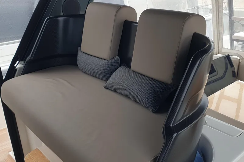 Point Break Yacht Photos Pics Interior seating of 2021 Bluegame BG 42 yacht with cushioned backrests and pillows.