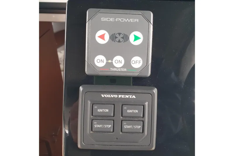 Point Break Yacht Photos Pics Control panel of a 2021 Bluegame BG 42 yacht featuring Side-Power thruster and Volvo Penta ignition.