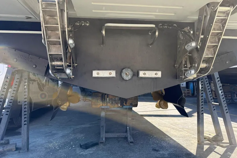 Point Break Yacht Photos Pics 2021 Bluegame BG 42 yacht stern view with propellers and ladders.