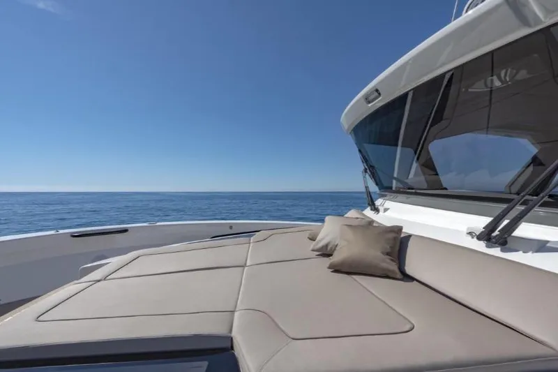 Point Break Yacht Photos Pics Luxury Bluegame BG 42 yacht deck with cushions, 2021 model, overlooking serene ocean.