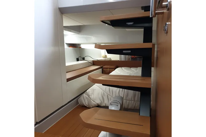 Point Break Yacht Photos Pics Interior of 2021 Bluegame BG 42 yacht, featuring modern wooden stairs and cozy cabin.