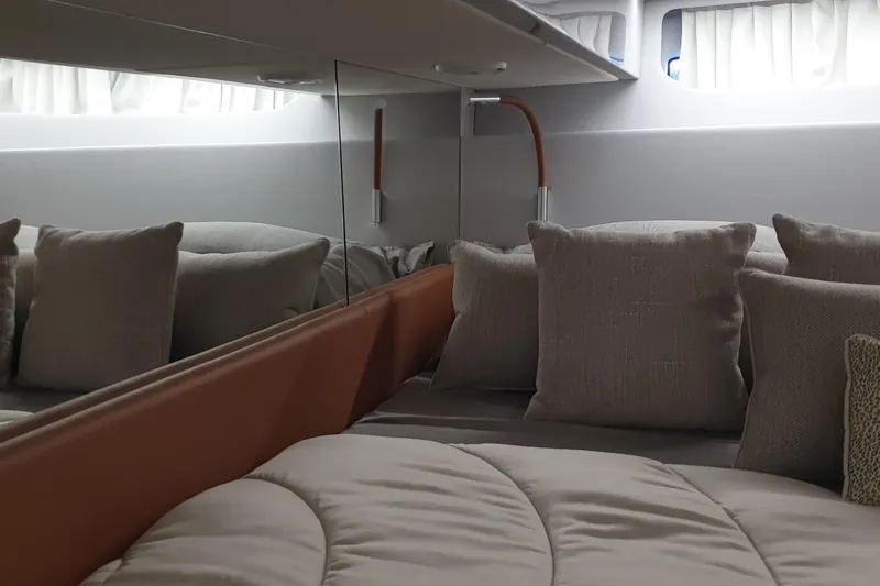Point Break Yacht Photos Pics Luxurious interior cabin of 2021 Bluegame BG 42 yacht with plush pillows and modern design.