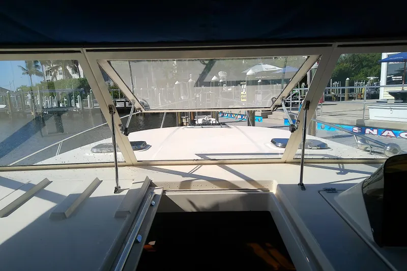 Dolce Far Niente Yacht Photos Pics 2004 Mainship 34 Pilot II boat interior view at marina dock.