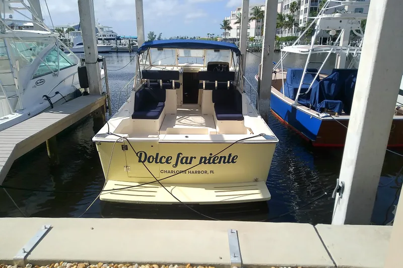Dolce Far Niente Yacht Photos Pics 2004 Mainship 34 Pilot II docked at Charlotte Harbor, Florida marina.