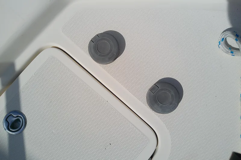 Dolce Far Niente Yacht Photos Pics Deck fittings on a 2004 Mainship 34 Pilot II boat, featuring textured surfaces and rope detail.