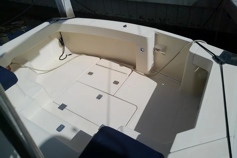 Dolce Far Niente Yacht Photos Pics 2004 Mainship 34 Pilot II boat cockpit with seating and storage compartments.