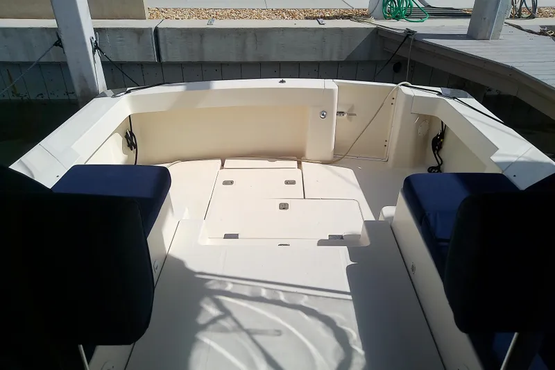 Dolce Far Niente Yacht Photos Pics 2004 Mainship 34 Pilot II boat cockpit with seating and storage compartments.