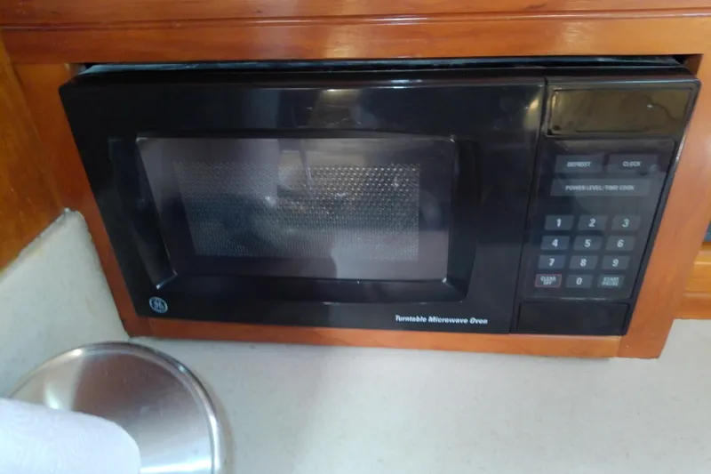 Dolce Far Niente Yacht Photos Pics Microwave oven in 2004 Mainship 34 Pilot II boat kitchen area.
